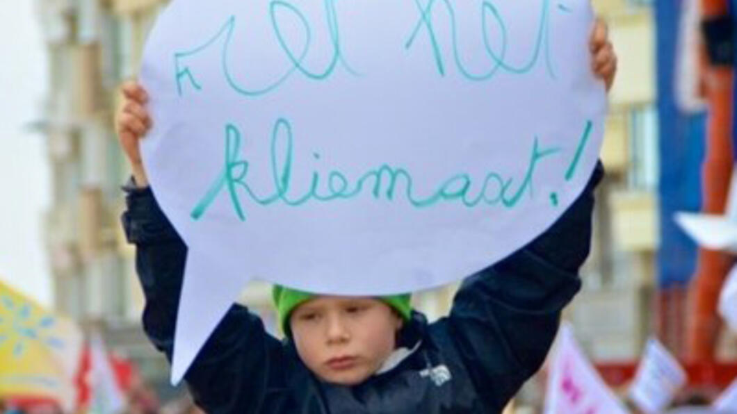 "Ret het kliemaat!" eist een jonge demonstrant